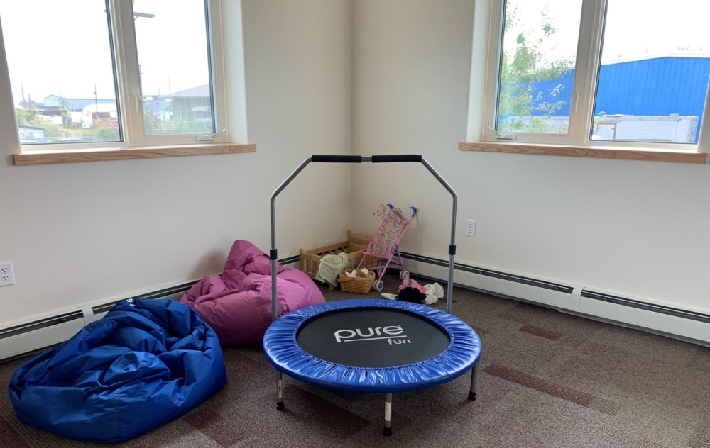 mini trampoline and toys in room
